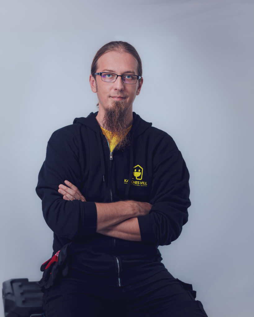 Electrician performing professional electrical installation work for homes and businesses, ensuring safety and compliance